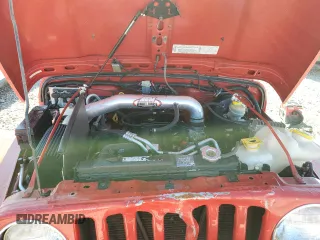 2003 Jeep Wrangler Rubicon z VIN 1J4FA69S93P352899, wystawiony jako Copart lot #56054425 z przebiegiem 3761 mil mil oraz Szkoda całkowita • Salvage title. Historia ofert i sprzedaży dostępna na DreamBid. Obrazek 11.