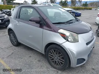 2014 Scion iQ with VIN JTNJJXB01EJ028930, listed as a IAAI auction lot 41771879 with 113,364 mi miles. Bid and sale history available at carsss.com. Image 1.