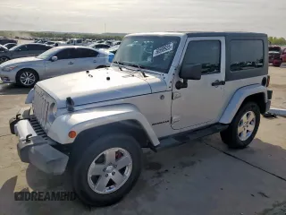 2009 Jeep Wrangler Sahara z VIN 1J4FA54169L780809, wystawiony jako Copart lot #50598925 z przebiegiem 121 078 mil mil oraz Szkoda całkowita • Salvage title. Historia ofert i sprzedaży dostępna na DreamBid. Obrazek 1.