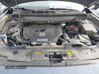 2021 Mazda CX-9 Grand Touring with VIN JM3TCADY1M0519288, listed as a IAAI auction lot 41186094 with 50,701 mi miles and . Bid and sale history available at DreamBid. Image 10.