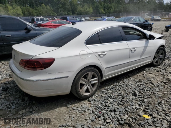 2014 Volkswagen CC Sport with VIN WVWBN7AN3EE528302, listed as a Copart auction lot 69636034 with 77,332 mi miles and Salvage Title. Bid and sale history available at DreamBid. Image 3.
