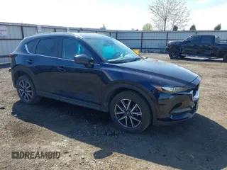 2018 Mazda CX-5 Touring with VIN JM3KFBCM5J0375070, listed as a IAAI auction lot 42043292 with 90,877 mi miles. Bid and sale history available at carsss.com. Image 1.