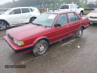 1990 Nissan Sentra z VIN JN1GB21B5LU503902, wystawiony jako IAAI lot #42358723 z przebiegiem 172 484 mil mil oraz . Historia ofert i sprzedaży dostępna na DreamBid. Obrazek 2.