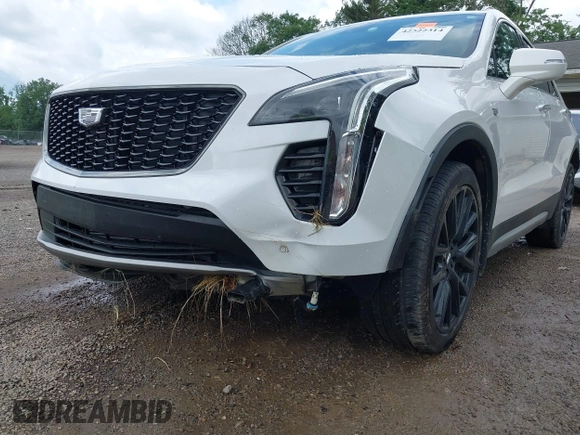 2022 Cadillac XT4 AWD Premium Luxury z VIN 1GYFZDR42NF128199, wystawiony jako IAAI lot #42522314 z przebiegiem 29 002 mil mil oraz . Historia ofert i sprzedaży dostępna na DreamBid. Obrazek 6.