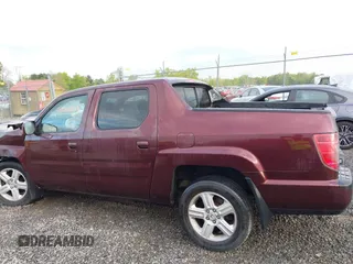 2010 Honda Ridgeline RTL with VIN 5FPYK1F57AB005602, listed as a IAAI auction lot 42208633 with 106,777 mi miles and . Bid and sale history available at DreamBid. Image 14.
