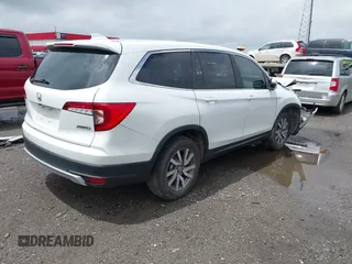 2020 Honda Pilot EX-L z VIN 5FNYF6H57LB067852, wystawiony jako IAAI lot #42172590 z przebiegiem 109 026 mil mil oraz . Historia ofert i sprzedaży dostępna na DreamBid. Obrazek 4.