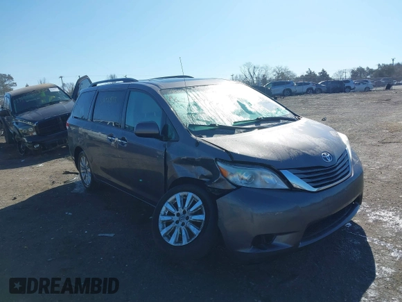 2014 Toyota Sienna Ltd with VIN 5TDDK3DC4ES083230, listed as a IAAI auction lot 41751843 with 184,501 mi miles. Bid and sale history available at carsss.com. Image 1.
