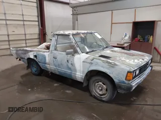 1982 Datsun 720 z VIN JN6MD01S7CW103064, wystawiony jako IAAI lot #41831434 z przebiegiem 175 954 mil mil oraz . Historia ofert i sprzedaży dostępna na DreamBid. Obrazek 1.