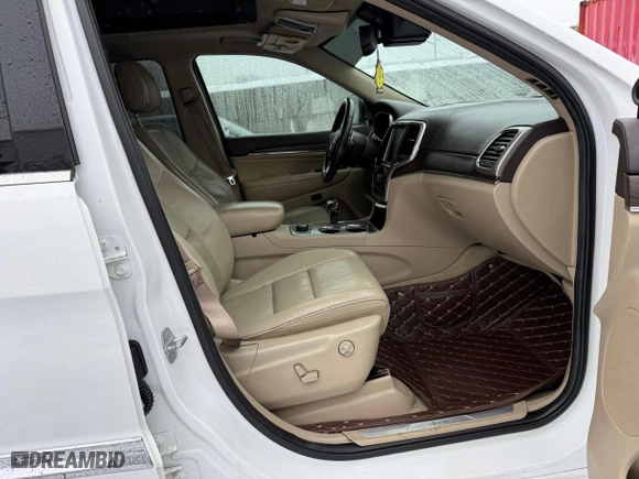 2014 Jeep Grand Cherokee Overland with VIN 1C4RJFCM1EC298621, listed as a Copart auction lot 54796775 with 142,491 mi miles and Clean Title. Bid and sale history available at carsss.com. Image 5.