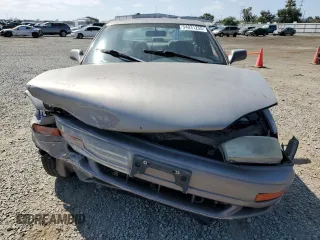 1994 Toyota Camry LE z VIN JT2GK12E6R0055565, wystawiony jako Copart lot #54031255 z przebiegiem 240 841 mil mil oraz Szkoda całkowita • Salvage title. Historia ofert i sprzedaży dostępna na DreamBid. Obrazek 5.