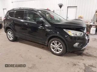 2017 Ford Escape SE with VIN 1FMCU9G98HUD67920, listed as a IAAI auction lot 40937291 with 124,302 mi miles. Bid and sale history available at carsss.com. Image 1.