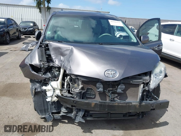 2014 Toyota Sienna XLE with VIN 5TDYK3DC7ES517206, listed as a IAAI auction lot 41945572 with 128,743 mi miles and . Bid and sale history available at DreamBid. Image 6.