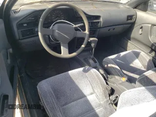 1990 Toyota Corolla z VIN JT2AE96J0L3382052, wystawiony jako Copart lot #57894754 z przebiegiem 90 550 mil mil oraz Czysty tytuł • Clean title. Historia ofert i sprzedaży dostępna na DreamBid. Obrazek 8.