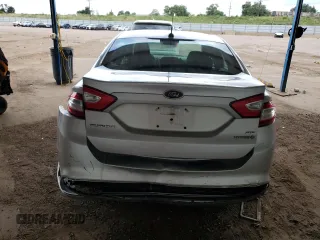 2013 Ford Fusion SE Hybrid z VIN 3FA6P0LU2DR104182, wystawiony jako Copart lot #63107545 z przebiegiem 249 317 mil mil oraz Szkoda całkowita • Salvage title. Historia ofert i sprzedaży dostępna na DreamBid. Obrazek 6.
