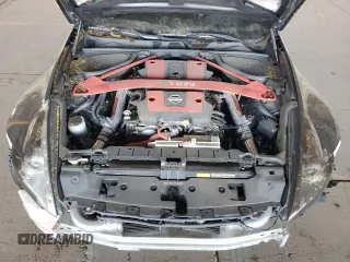 2009 Nissan 370Z z VIN JN1AZ44E19M411715, wystawiony jako Copart lot #56654815 z przebiegiem 123 791 mil mil oraz Szkoda całkowita • Salvage title. Historia ofert i sprzedaży dostępna na DreamBid. Obrazek 11.