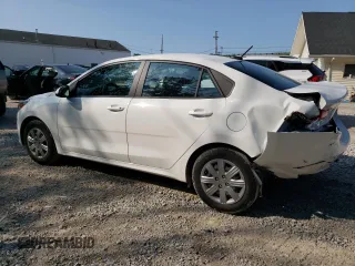 2023 Kia Rio S with VIN 3KPA24AD3PE597752, listed as a Copart auction lot 64836674 with 8,434 mi miles and Salvage Title. Bid and sale history available at carsss.com. Image 2.