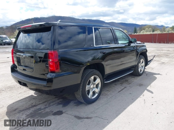 2017 Chevrolet Tahoe LT with VIN 1GNSKBKC5HR233537, listed as a IAAI auction lot 42051281 with 102,778 mi miles and . Bid and sale history available at DreamBid. Image 4.