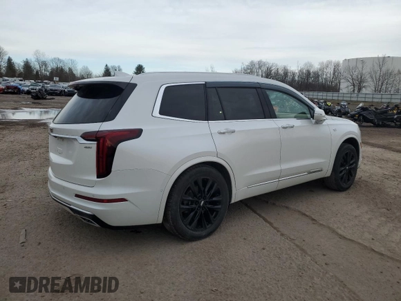 2022 Cadillac XT6 Premium Luxury with VIN 1GYKPFRS2NZ120147, listed as a Copart auction lot 49047855 with 59,691 mi miles and Salvage Title. Bid and sale history available at carsss.com. Image 3.