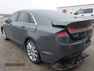 2015 Lincoln MKZ z VIN 3LN6L2G99FR604894, wystawiony jako IAAI lot #41433264 z przebiegiem 262 472 mil mil oraz . Historia ofert i sprzedaży dostępna na DreamBid. Obrazek 3.