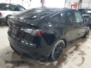2023 Tesla Model Y Long Range with VIN 7SAYGDEE2PF808844, listed as a IAAI auction lot 41941905 with 39,951 mi miles and . Bid and sale history available at carsss.com. Image 4.