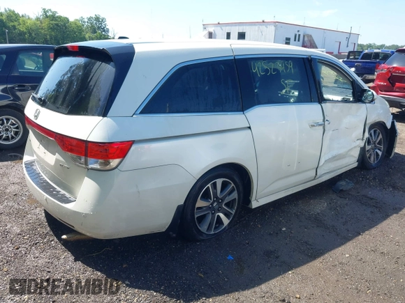 2014 Honda Odyssey Touring with VIN 5FNRL5H94EB071788, listed as a IAAI auction lot 42523959 with 244,734 mi miles and . Bid and sale history available at DreamBid. Image 4.