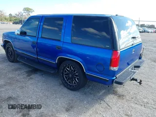 1997 GMC Yukon with VIN 1GKEC13R0VJ744958, listed as a IAAI auction lot 41474196 with 257,847 mi miles. Bid and sale history available at carsss.com. Image 3.