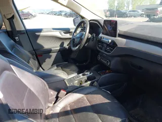 2020 Ford Escape SEL z VIN 1FMCU9H94LUB39999, wystawiony jako IAAI lot #42266705 z przebiegiem 95 462 mil mil oraz . Historia ofert i sprzedaży dostępna na DreamBid. Obrazek 5.
