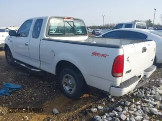 2000 Ford F-150 XL with VIN 1FTZX1729YNC01295, listed as a IAAI auction lot 41298499 with 1 mi miles. Bid and sale history available at carsss.com. Image 3.