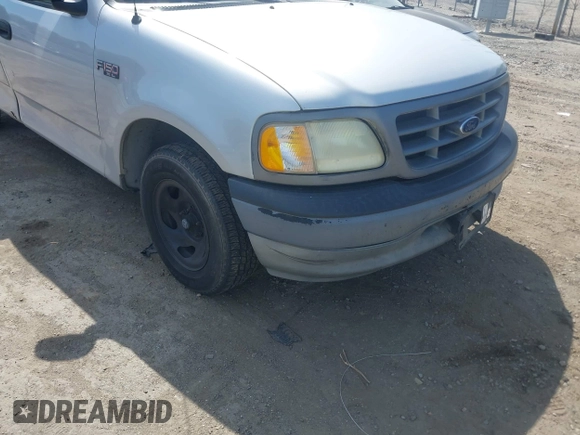 2002 Ford F-150 XL with VIN 1FTRF17202NB42616, listed as a IAAI auction lot 42117616 with 230,852 mi miles. Bid and sale history available at carsss.com. Image 6.