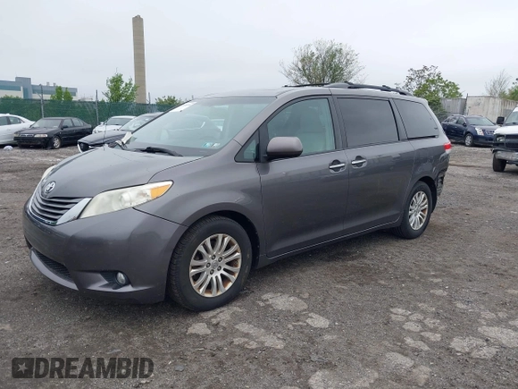 2014 Toyota Sienna XLE with VIN 5TDYK3DC0ES436502, listed as a IAAI auction lot 42180990 with 154,839 mi miles and . Bid and sale history available at DreamBid. Image 2.