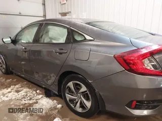 2020 Honda Civic LX z VIN 19XFC2F65LE030888, wystawiony jako IAAI lot #41609630 z przebiegiem 115 614 mil mil oraz . Historia ofert i sprzedaży dostępna na DreamBid. Obrazek 14.