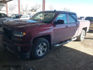 2016 Chevrolet Silverado 1500 LT with VIN 3GCUKREC9GG323309, listed as a IAAI auction lot 41653595 with 130,775 mi miles. Bid and sale history available at carsss.com. Image 2.