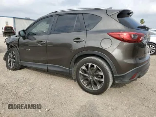 2016 Mazda CX-5 Grand Touring z VIN JM3KE2DY7G0735355, wystawiony jako Copart lot #49438285 z przebiegiem 132 731 mil mil oraz Szkoda całkowita • Salvage title. Historia ofert i sprzedaży dostępna na DreamBid. Obrazek 2.