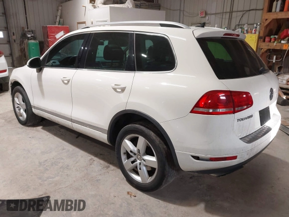 2011 Volkswagen Touareg Sport with VIN WVGFF9BP8BD004747, listed as a IAAI auction lot 41780515 with 159,228 mi miles and . Bid and sale history available at DreamBid. Image 3.
