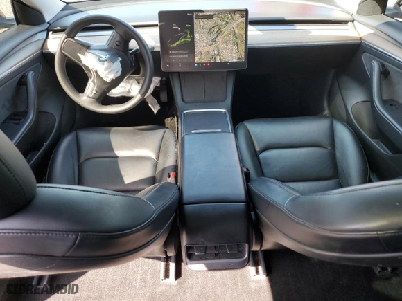 2021 Tesla Model 3 Standard Range Plus with VIN 5YJ3E1EA6MF067702, listed as a Copart auction lot 52048315 with 72,974 mi miles and Salvage Title. Bid and sale history available at carsss.com. Image 8.