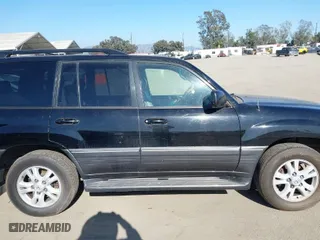 2004 Lexus LX 470 with VIN JTJHT00WX43543307, listed as a IAAI auction lot 41996860 with 211,652 mi miles. Bid and sale history available at carsss.com. Image 14.