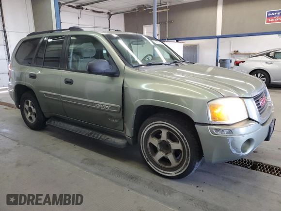 2004 GMC Envoy SLE with VIN 1GKDS13S442417232, listed as a Copart auction lot 51821225 with 242,945 mi miles and Salvage Title. Bid and sale history available at carsss.com. Image 4.