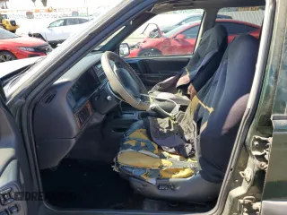 1996 Jeep Grand Cherokee Laredo with VIN 1J4FX58S1TC169501, listed as a Copart auction lot 59143174 with 0 mi miles and Salvage Title. Bid and sale history available at carsss.com. Image 7.