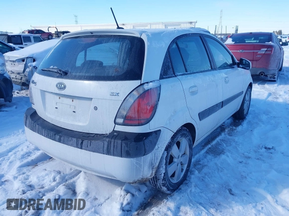 2009 Kia Rio LX with VIN KNADE243196500999, listed as a IAAI auction lot 41582717 with 119,877 mi miles. Bid and sale history available at carsss.com. Image 4.