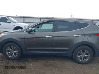 2014 Hyundai Santa Fe z VIN 5XYZTDLB1EG144290, wystawiony jako IAAI lot #42126367 z przebiegiem 138 525 mil mil oraz . Historia ofert i sprzedaży dostępna na DreamBid. Obrazek 14.