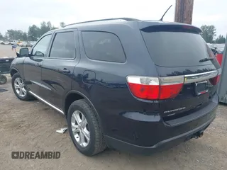 2013 Dodge Durango SXT with VIN 1C4RDJAG5DC697022, listed as a IAAI auction lot 42474060 with 159,723 mi miles and . Bid and sale history available at DreamBid. Image 3.