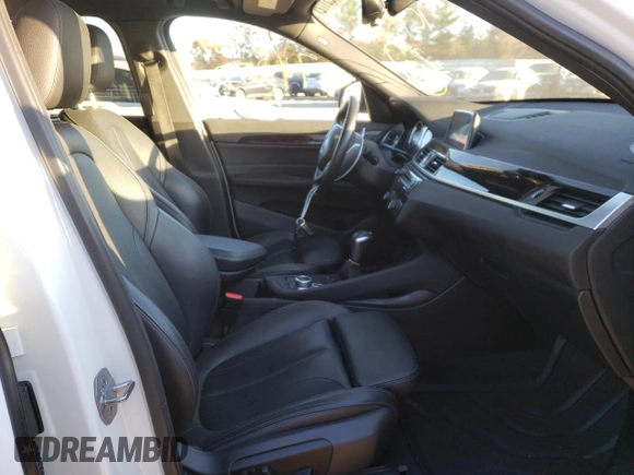 2018 BMW X1 xDrive28i with VIN WBXHT3C38J5L31384, listed as a Copart auction lot 66323172 with 74,272 mi miles. Bid and sale history available at carsss.com. Image 5.