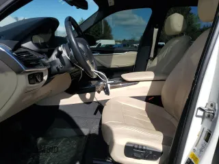 2018 BMW X5 xDrive35i with VIN 5UXKR0C53J0X93705, listed as a Copart auction lot 51715435 with 106,677 mi miles and Salvage Title. Bid and sale history available at carsss.com. Image 7.