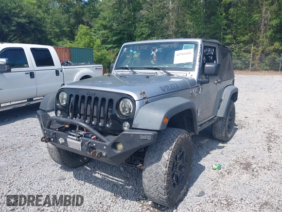 2015 Jeep Wrangler Freedom Edition with VIN 1C4AJWAG4FL589769, listed as a IAAI auction lot 42704488 with 194,414 mi miles and . Bid and sale history available at DreamBid. Image 17.
