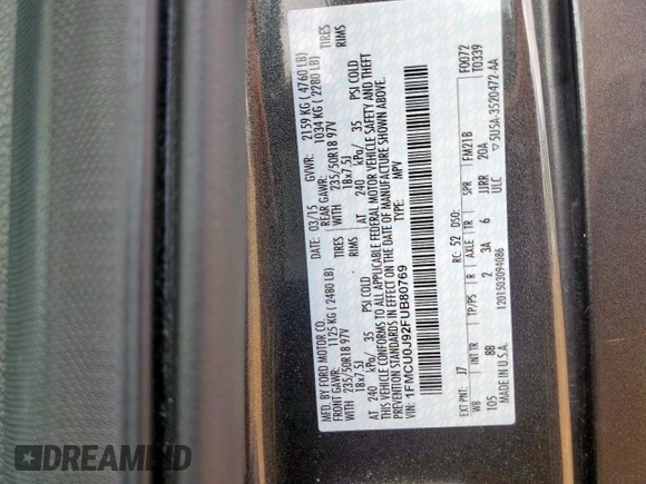 2015 Ford Escape Titanium with VIN 1FMCU0J92FUB80769, listed as a Copart auction lot 61988435 with 103,212 mi miles and Salvage title. Bid and sale history available at DreamBid. Image 13.