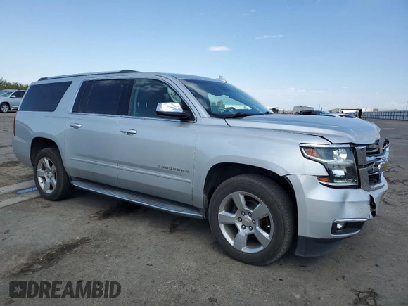 2020 Chevrolet Suburban Premier with VIN 1GNSCJKC0LR216855, listed as a Copart auction lot 72287114 with 94,642 mi miles and Salvage title. Bid and sale history available at DreamBid. Image 4.