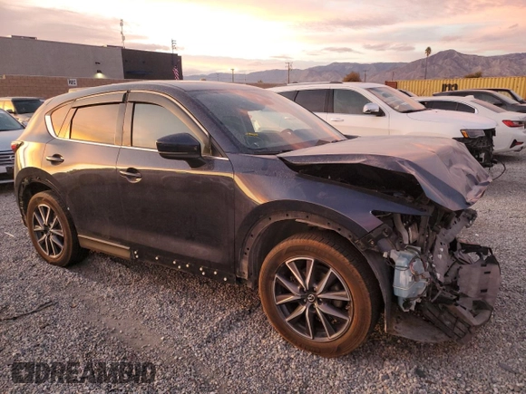 2018 Mazda CX-5 Grand Touring with VIN JM3KFBDM9J1326933, listed as a Copart auction lot 82180164 with 99,574 mi miles and Salvage title. Bid and sale history available at DreamBid. Image 4.