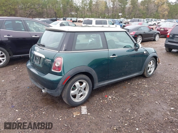 2009 MINI Cooper Hardtop with VIN WMWMF33579TW72493, listed as a IAAI auction lot 41861584 with 136,341 mi miles. Bid and sale history available at carsss.com. Image 4.