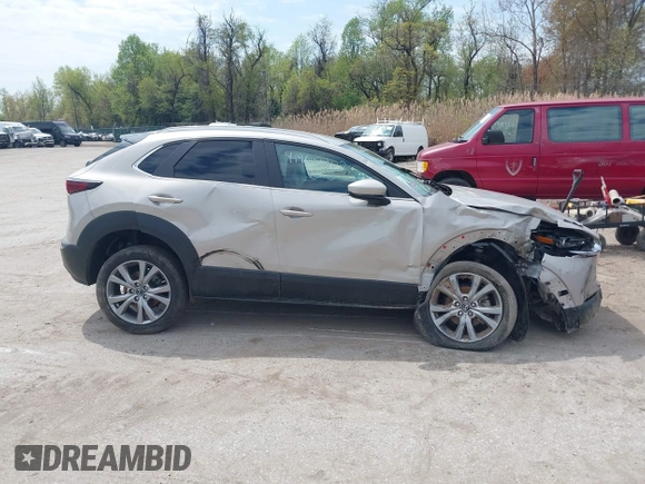 2022 Mazda CX-30 S Select z VIN 3MVDMBBL2NM439681, wystawiony jako IAAI lot #41960902 z przebiegiem 22 730 mil mil oraz . Historia ofert i sprzedaży dostępna na DreamBid. Obrazek 13.