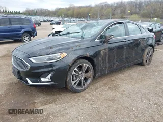 2020 Ford Fusion Titanium with VIN 3FA6P0D9XLR174523, listed as a IAAI auction lot 42100113 with 100,602 mi miles and . Bid and sale history available at DreamBid. Image 18.